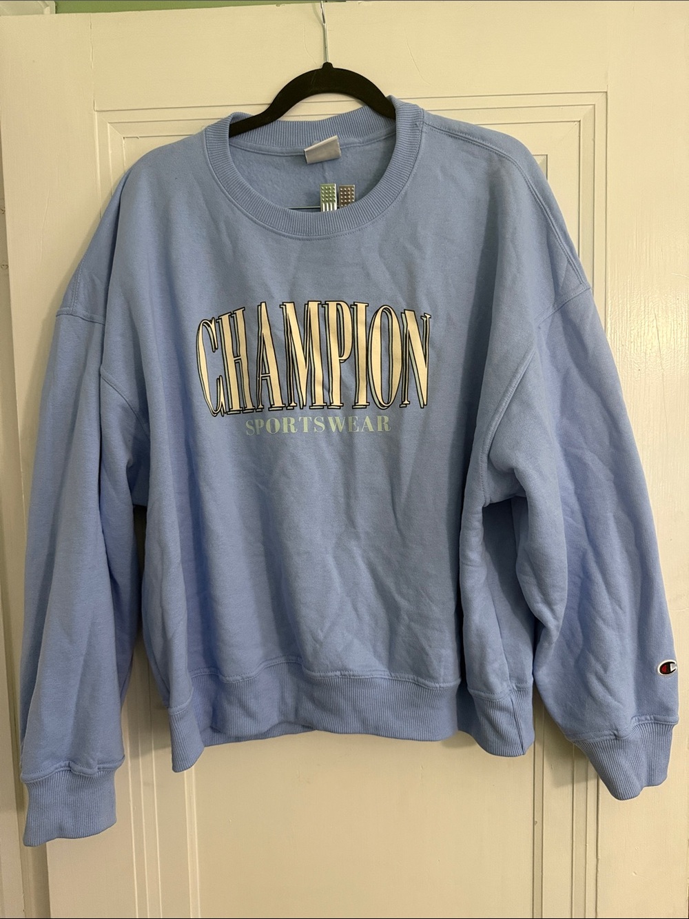 Champion Light Blue Crewneck with stylized 'CHAMPION' Front Logo
